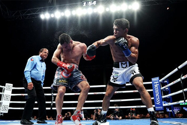 Murodjon Akhmadaliev defeats Ronny Rios
