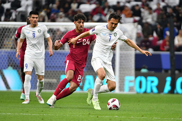 Qatar edge Uzbekistan in dramatic shoot-out to keep dream alive