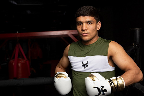 Murodjon Akhmadaliev defeated Kevin Gonzalez